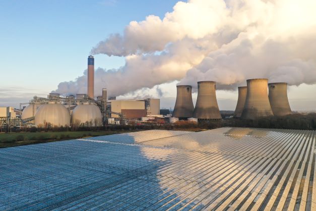 Drax Power Station pumping steam and smoke from its chimney and cooling towers whilst generating non